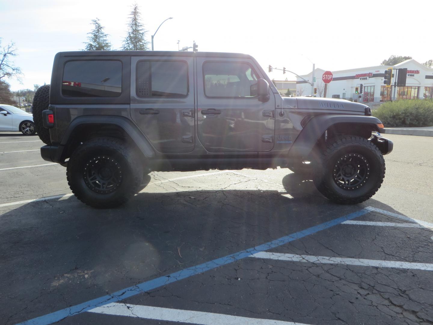 2023 CHARCOAL /black Jeep Wrangler Unlimited Willys 4XE (1C4JJXN68PW) with an 2.0L L4 DOHC 16V HYBRID engine, 8A transmission, located at 2630 Grass Valley Highway, Auburn, CA, 95603, (530) 508-5100, 38.937893, -121.095482 - 3" Zone Offroad lift kit, Fox Adventure series shocks, 17" Method Race wheels, 37" BFG KO2 tires, and a Teraflex spare tire carrier. - Photo#3